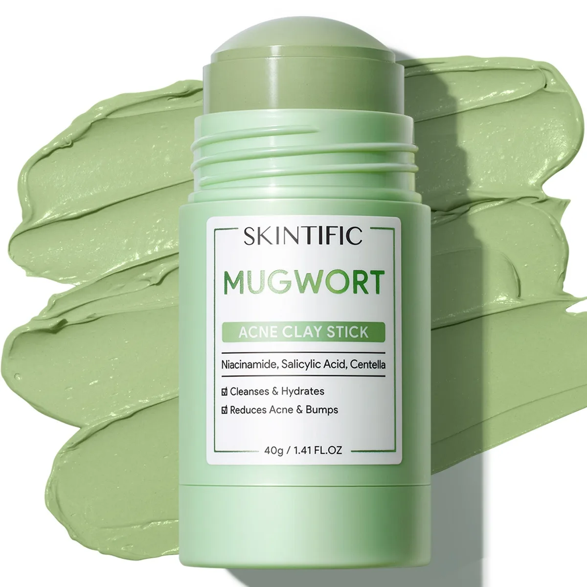Skintific Mugwort Acne Clay Stick 40 g pale green twist-up stick against a swatch of green clay